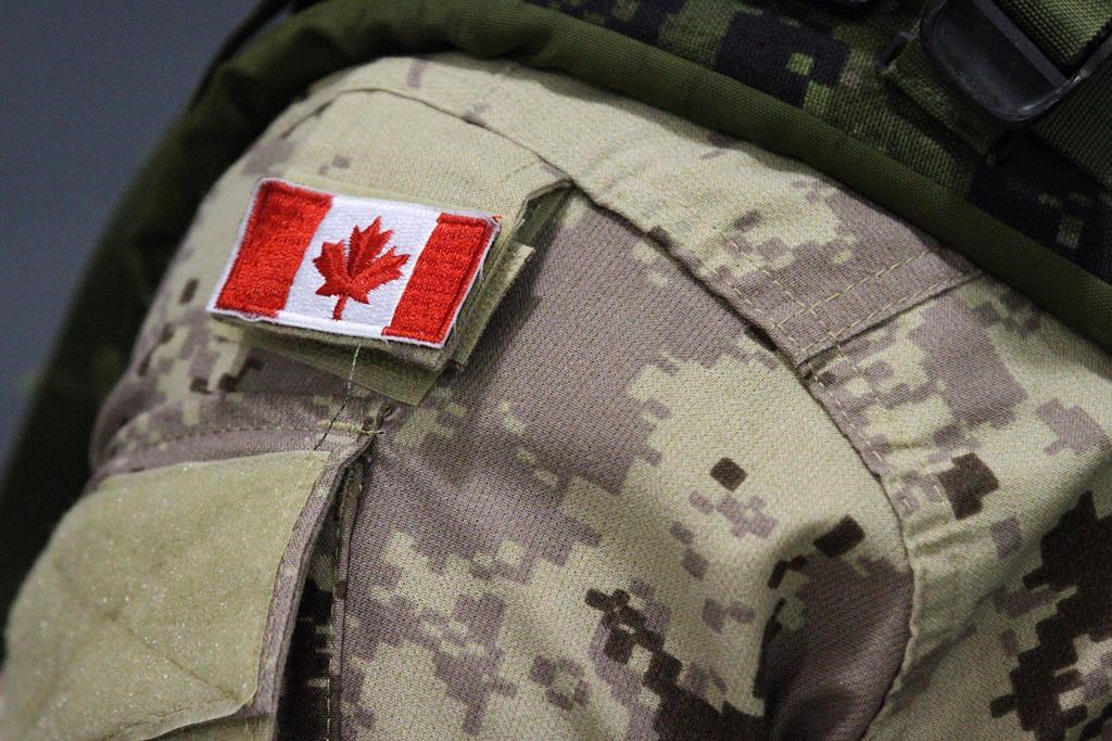 A Canadian flag patch is shown on a soldier's shoulder in Trenton, Ont., on Thursday, Oct. 16, 2014; THE CANADIAN PRESS/Lars Hagberg