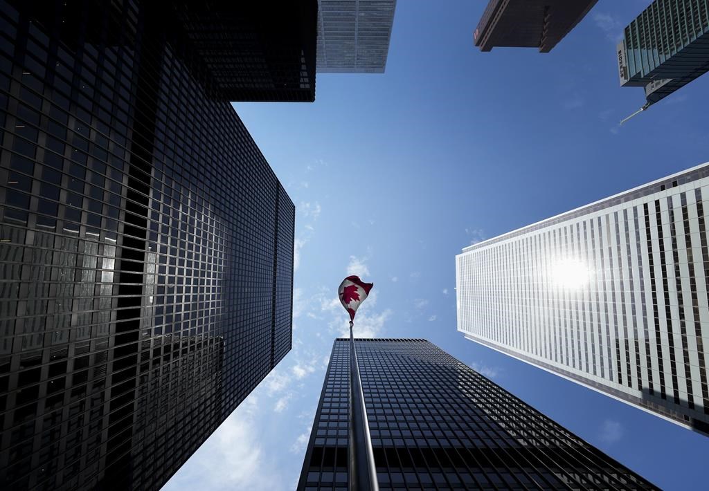 The Bay Street Financial District is shown with the Canadian flag in Toronto on Friday, August 5, 2022. New research suggests half of Canadian workers plan to look for a new job in 2023, a nearly two-fold increase from a year ago.THE CANADIAN PRESS/Nathan Denette