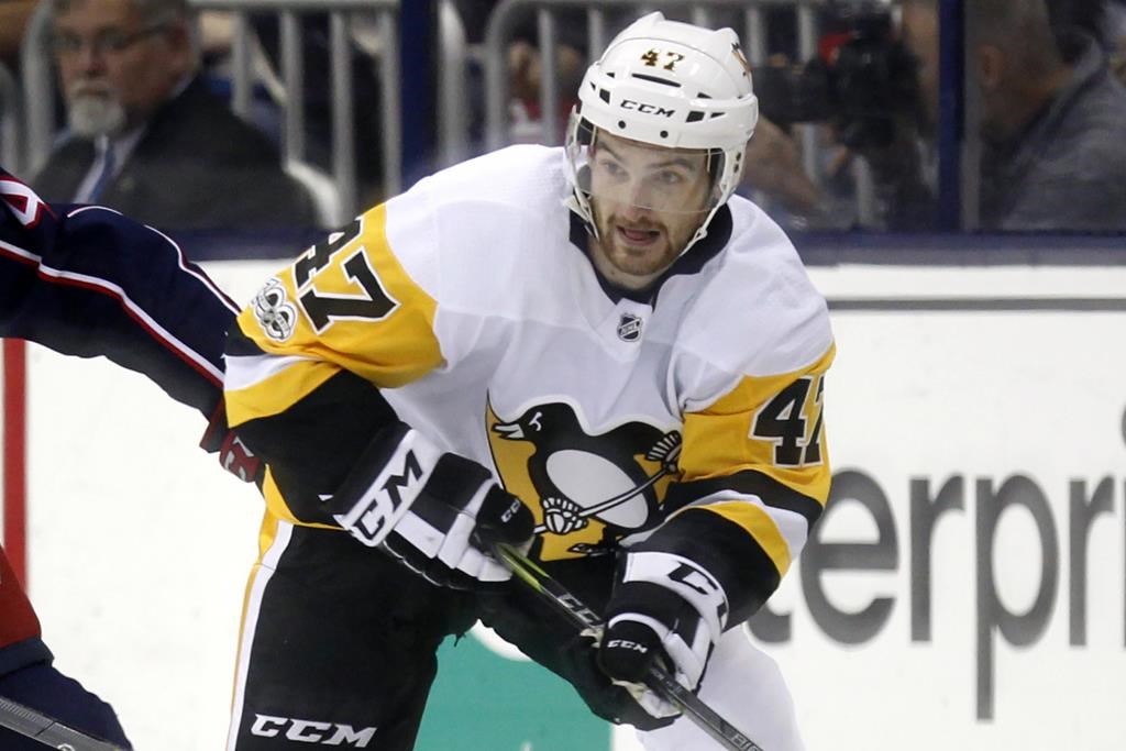 FILE - Pittsburgh Penguins forward Adam Johnson in action during an NHL hockey game in Columbus, Ohio, Friday, Sept. 22, 2017. American hockey player Adam Johnson has died after a “freak accident” during a game in England on Saturday, Oct. 28, 2023 his club said. The 29-year-old Minnesota native was playing for the Nottingham Panthers in a Challenge Cup game against the Sheffield Steelers when he suffered a slashed neck during the second period of the game at Sheffield’s Utilita Arena. (AP Photo/Paul Vernon, file)