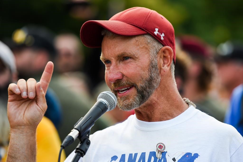 James Topp speaks to the crowd during a protest against COVID-19 health measures at the National War Memorial in Ottawa, Ont. on Thursday, June 30, 2022. THE CANADIAN PRESS/Spencer Colby