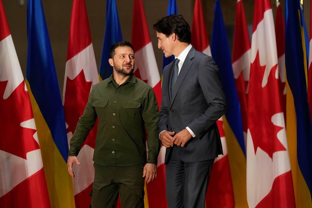 Ukrainian President Volodymyr Zelenskyy, left, and Prime Minister Justin Trudeau talk before a joint press conference on Parliament Hill in Ottawa on Friday, Sept. 22, 2023. THE CANADIAN PRESS/Adrian Wyld