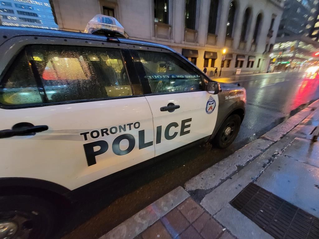 Ontario's police watchdog has charged a Toronto police officer with manslaughter and aggravated assault in the April 2021 death of a 19-year-old while he was off-duty. A Toronto police vehicle is shown parked on Yonge Street in downtown Toronto on Tuesday Jan. 3, 2023. THE CANADIAN PRESS/Doug Ives