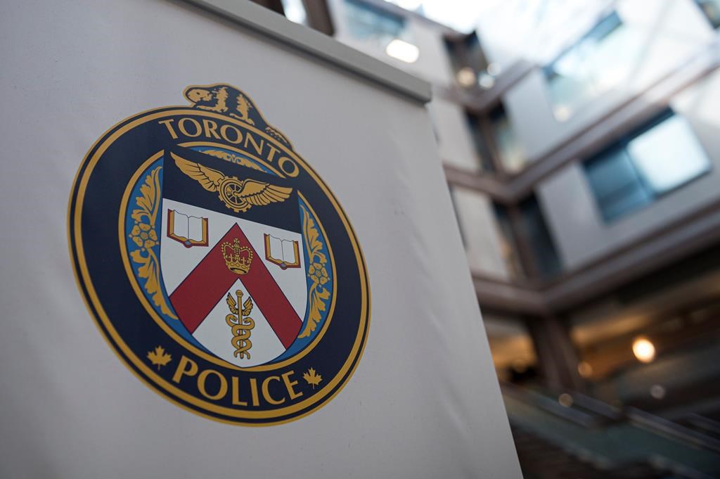 A Toronto Police Services logo is shown at headquarters in Toronto on Friday, August 9, 2019.&nbsp;Toronto police say they have laid close to a 100 counts of various charges that include sexual assault on a 31-year-old man who allegedly lured and exploited kids from across Ontario in person and on eight different online applications. THE CANADIAN PRESS/Christopher Katsarov