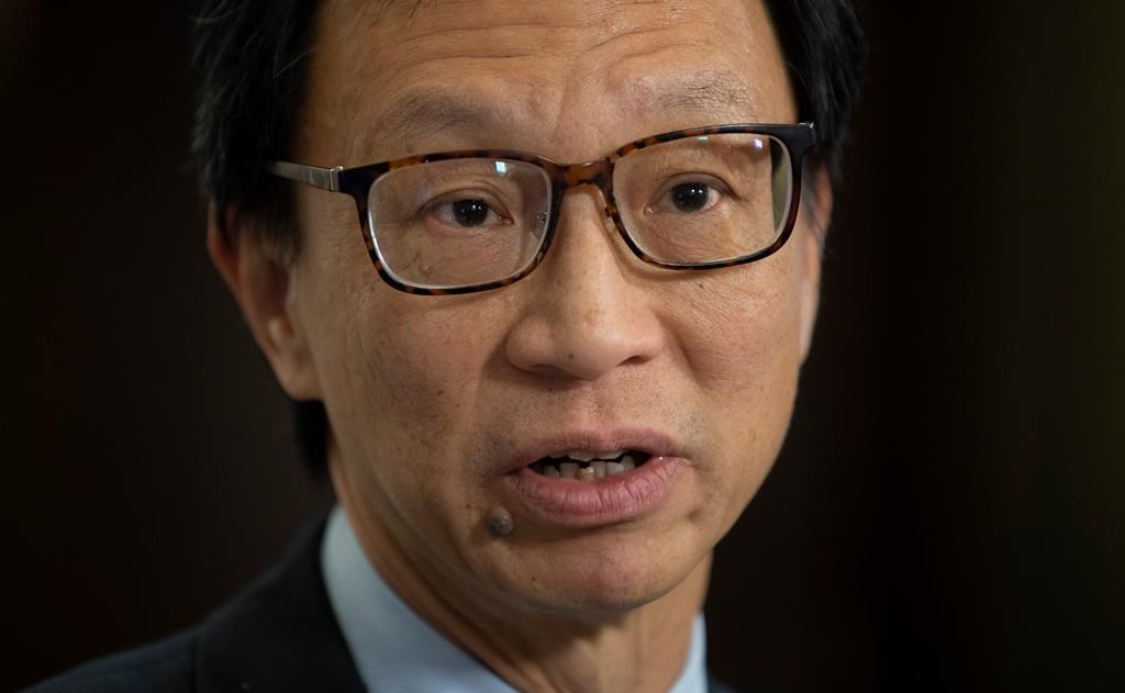 Senator Yuen Pau Woo, facilitator of the Independent Senators Group (ISG) speaks with the media in the foyer of the Senate in Ottawa on Thursday Nov. 28, 2019. Woo questions whether a foreign influence registry might become "a modern form of Chinese exclusion," and says angry reaction to his suggestion proves his point about racial profiling and stigmatization. THE CANADIAN PRESS/Adrian Wyld