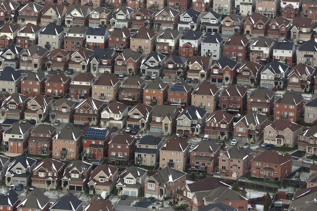 An aerial view of houses in Oshawa, Ont. is shown on Saturday, Nov. 11, 2017. A Royal Bank of Canada report predicts Canada's rental housing shortage will quadruple to 120,000 units by 2026 without a significant boost in rental stock. THE CANADIAN PRESS/Lars Hagberg