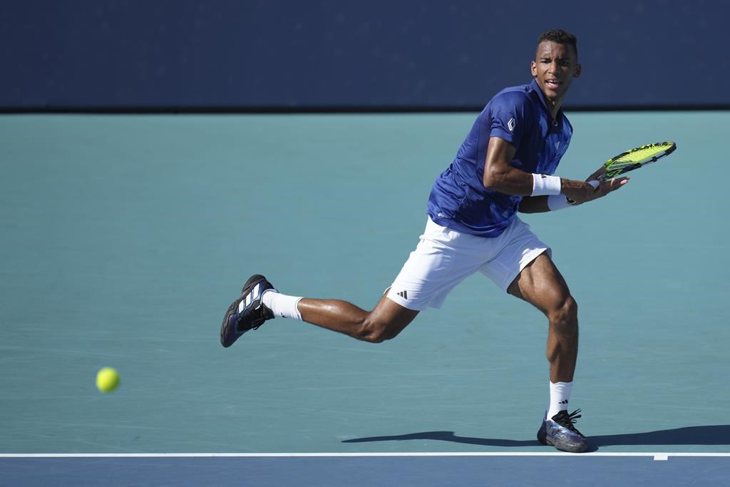 Felix Auger Aliassime, of Canada, returns a volley against Thiago Monteiro, of Brazil, in the first set of a match at the Miami Open tennis tournament in Miami Gardens, Fla., Saturday, March 25, 2023. Auger-Aliassime is out of the Miami Open after being upset 6-2, 7-5 in a third-round match with Argentina's Francisco Cerundolo. THE CANADIAN PRESS/AP-Jim Rassol