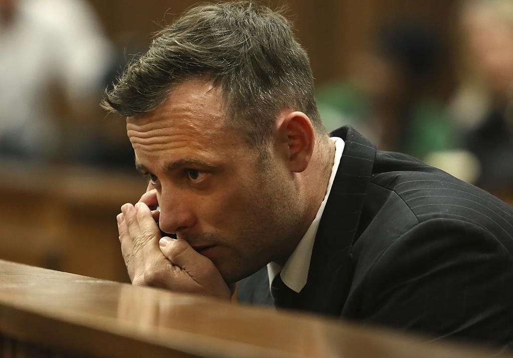 FILE - Oscar Pistorius speaks on a mobile phone during his sentencing hearing for murdering girlfriend Reeva Steenkamp in the High Court in Pretoria, South Africa, June 15, 2016. Former Olympic runner Oscar Pistorius was denied parole Friday, March 31, 2023 after it was decided that he had not served the “minimum detention period” required to be released from prison following his murder conviction for the 2013 killing of girlfriend Reeva Steenkamp. (Alon Skuy/Pool Photo via AP, File)