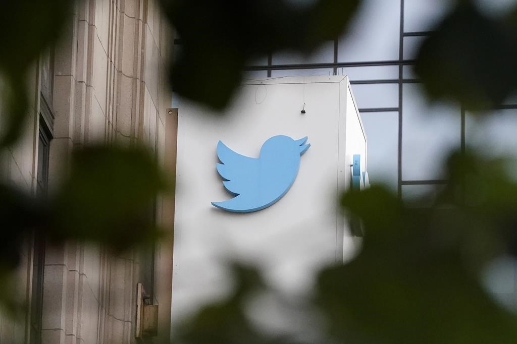 FILE - A sign at Twitter headquarters is shown in San Francisco, Dec. 8, 2022. Billionaire Elon Musk has told the BBC that running Twitter has been “quite painful” but that the social media company is now roughly breaking even after he acquired it late last year. (AP Photo/Jeff Chiu, File)