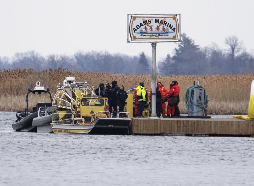 Searchers dock at a marina in Akwesasne, Que. Friday, March 31, 2023. The search continues for a man missing from the Mohawk community of Akwesasne in an area of the St. Lawrence River where the bodies of eight migrants were recovered earlier this week. THE CANADIAN PRESS/Ryan Remiorz