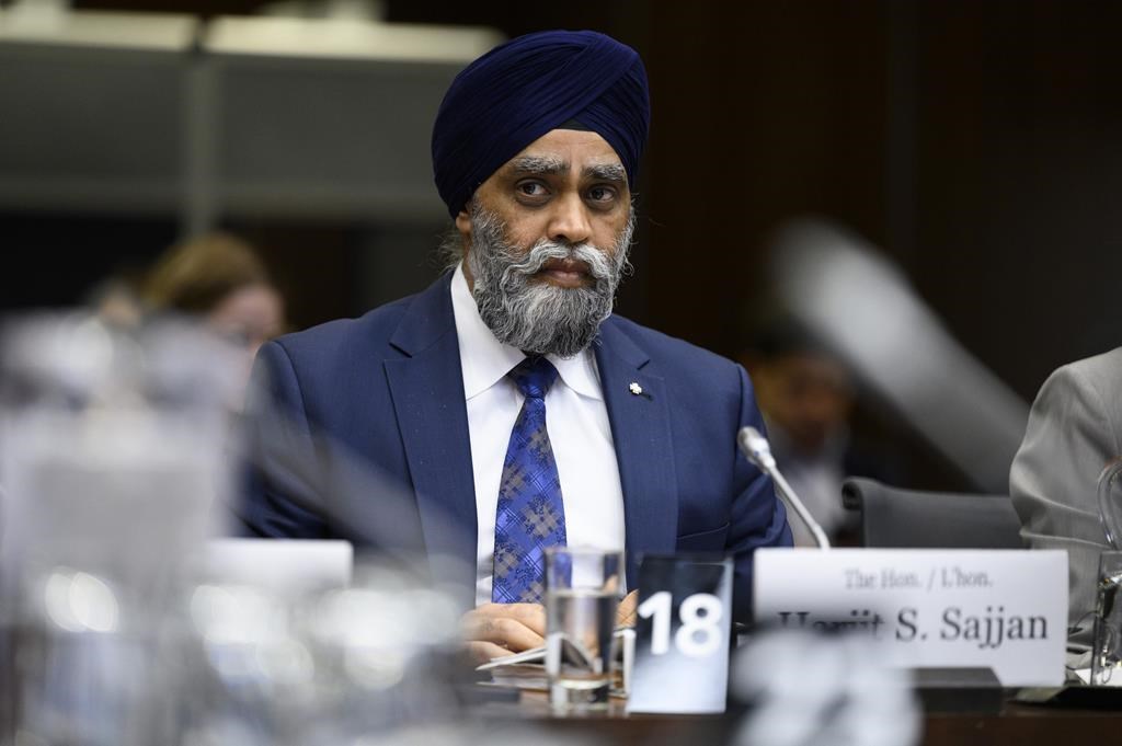 Minister of International Development Harjit Sajjan prepares to appear at the Standing Committee on Citizenship and Immigration, studying the government's response to the final report on the Special Committee on Afghanistan, in Ottawa, on Wednesday, April 26, 2023. THE CANADIAN PRESS/Justin Tang