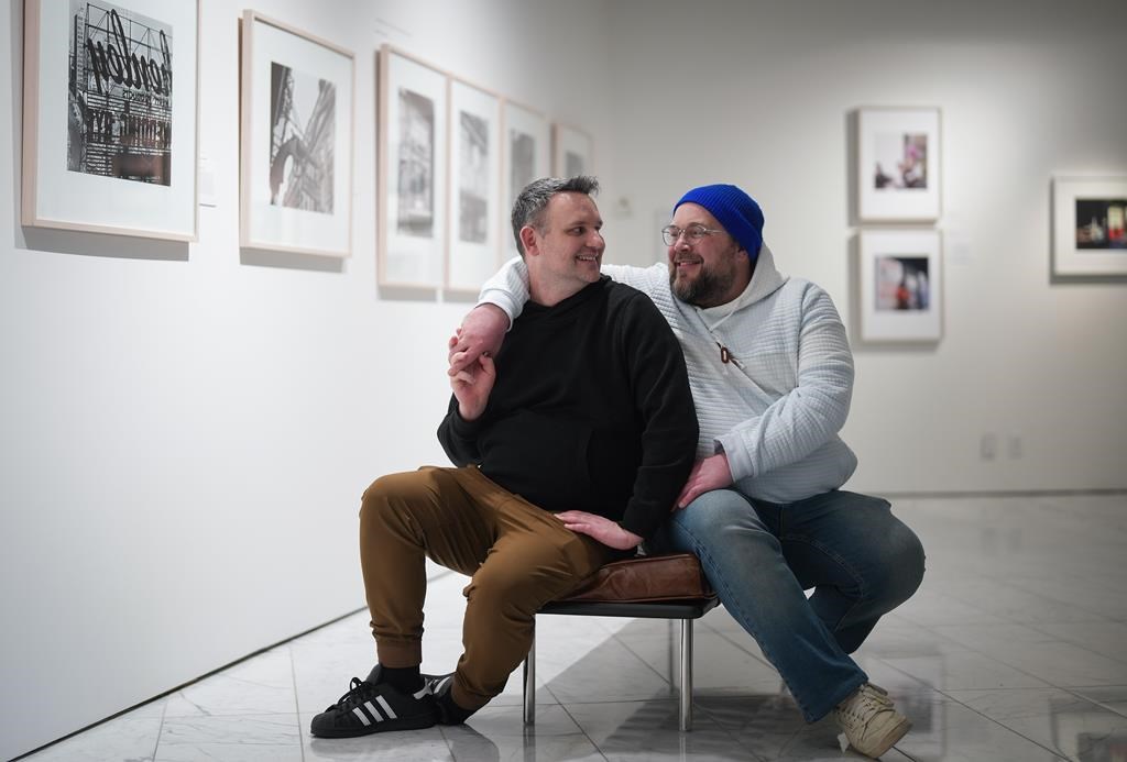 TikTok influencers, comedians Jeremy Baer, left, and Darcy Michael, a married couple from Ladner, B.C., pose for a photograph in Vancouver, on Friday, April 21, 2023. THE CANADIAN PRESS/Darryl Dyck