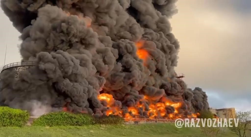 In this handout photo taken from video released by the Governor of Sevastopol Mikhail Razvozhaev telegram channel on Saturday, April 29, 2023, smoke and flame rise from a burning fuel tank in Sevastopol, Crimea. A massive fire erupted at an oil reservoir there after it was hit by a drone, a Russian-appointed official there reported on Saturday. (Sevastopol Governor Mikhail Razvozhaev telegram channel via AP)