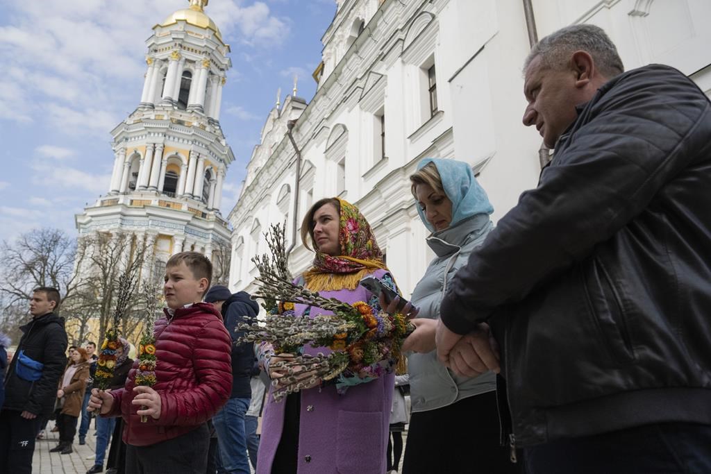 Worshipers gather to celebrate Palm Sunday at Kiev-Pechersk Lavra monastery, Ukraine's most revered Orthodox site in Kyiv, Ukraine, Sunday, April 9, 2023. (AP Photo/Adam Pemble)