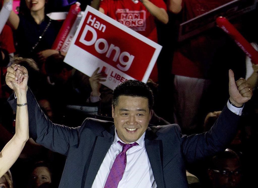 Provincial Liberal candidate Han Dong celebrates with supporters while taking part in a rally in Toronto on Thursday, May 22, 2014. Prime Minister Justin Trudeau is leaving the door open should Independent MP Han Dong decide he wants to rejoin the Liberal party. THE CANADIAN PRESS/Nathan Denette