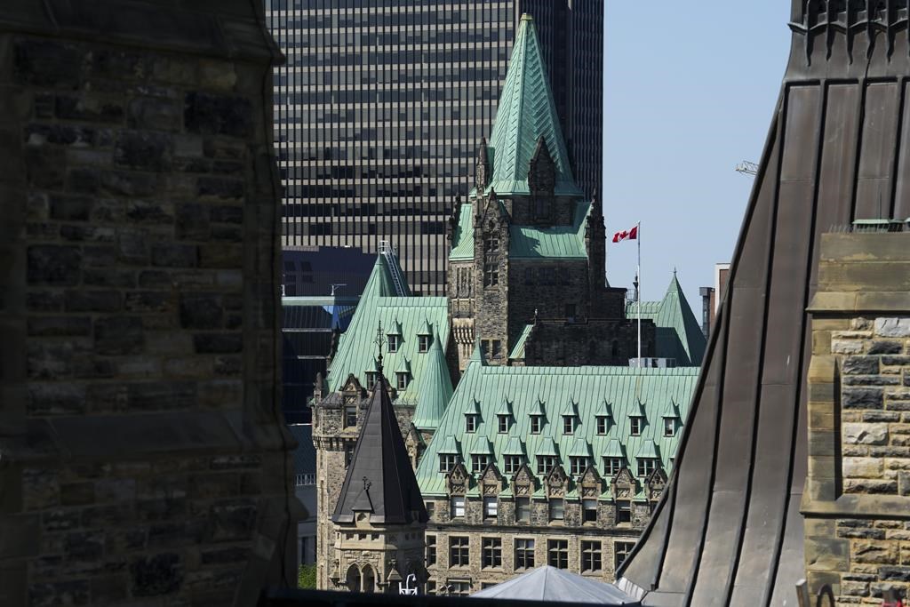 <div>An influx of asylum claimants has flooded homeless shelters, temporary housing and social services in Ottawa. The Confederation building is pictured from the roof of the Centre Block on Parliament Hill in Ottawa on Thursday, June 22, 2023. THE CANADIAN PRESS/Sean Kilpatrick</div>