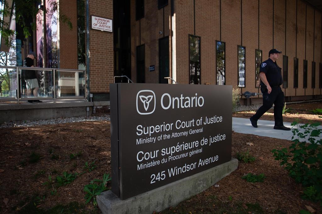 A police officer is seen outside Superior Court in Windsor, Ont., on day one of the trial of a man facing terror-related murder charges in the 2021 deaths of four members of a Muslim family, on Tuesday, Sept.5, 2023. THE CANADIAN PRESS/Dax Melmer