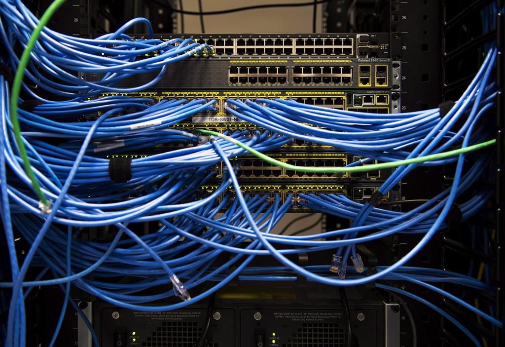 Networking cables and circuit boards are shown in Toronto on Wednesday, November 8, 2017. The parent company of The Weather Network says it was affected by a cybersecurity incident that took down some of its data systems. THE CANADIAN PRESS/Nathan Denette