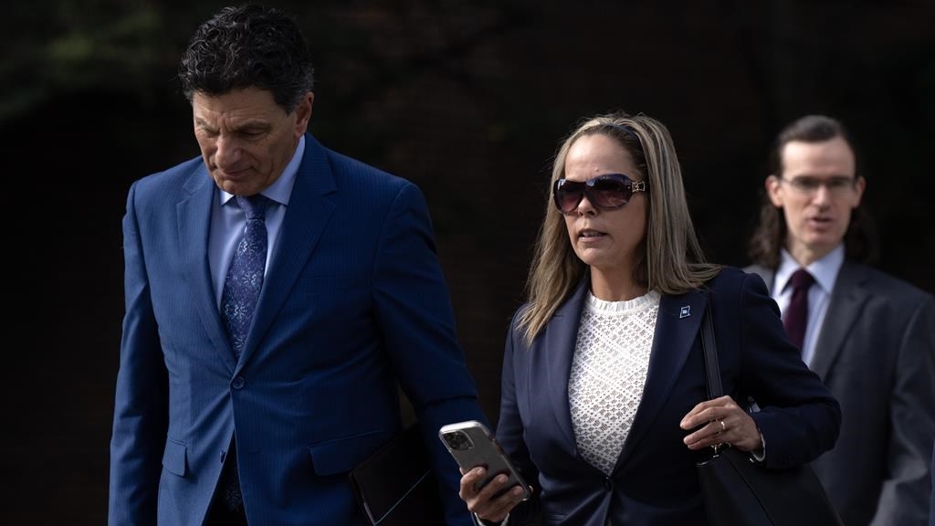 Tamara Lich walks with her lawyer Lawrence Greenspon as they make their way to the courthouse for trial, Wednesday, Sept. 13, 2023 in Ottawa. The defence lawyers for two "Freedom Convoy" organizers are expected to show the court a more peaceful view of the protest, as they cross-examine the officer assigned to social media evidence for the trial. THE CANADIAN PRESS/Adrian Wyld