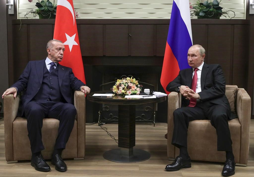 FILE - Russian President Vladimir Putin, right, and Turkish President Recep Tayyip Erdogan talk to each other during their meeting in the Bocharov Ruchei residence in the Black Sea resort of Sochi, Russia, Wednesday, Sept. 29, 2021. Turkish President Recep Tayyip Erdogan will meet with Vladimir Putin on Monday, Sept. 4, 2023 in a bid to persuade the Russian leader to rejoin the Black Sea grain deal that Moscow broke off from in July. (Vladimir Smirnov, Sputnik, Kremlin Pool Photo via AP, File)