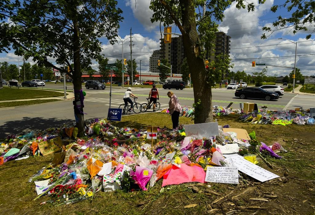 The trial of a man facing terror-related murder charges in the deaths of four members of a Muslim family in London, Ont., in 2021 is set to start today. Jury selection will begin for the trial of Nathaniel Veltman, who is accused of deliberately hitting the Afzaal family members with his truck as they were out for a walk on the evening of June 6, 2021. A women visits the scene and a tribute to the victims on June 14, 2021. THE CANADIAN PRESS/Nathan Denette