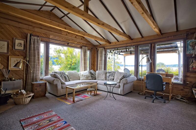 The 900-square-foot home features one bedroom and one full bathroom, with a wood-burning fireplace and a large deck. (Sotheby’s International Realty Canada)